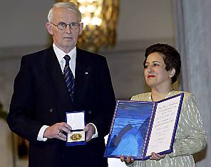 Iranian lawyer and human rights advocate Shirin Ebadi receiving the Nobel Peace Prize from committee leader Ole Danbolt Mjoes at the ceremony in Oslo's City Hall.